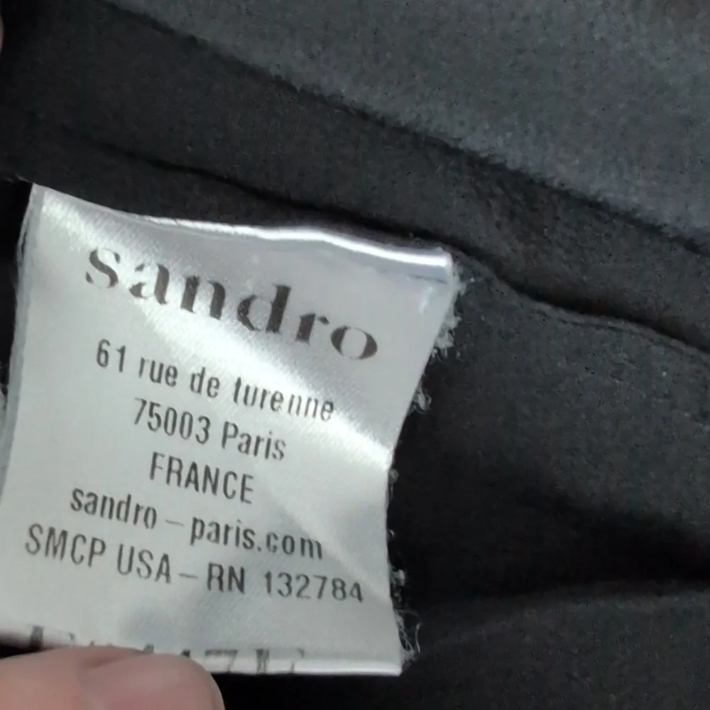 Sandro Paris black Silk blouse , pleated front and sleeves.